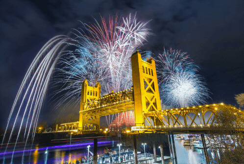 Fireworks going off above Tower Bridge in Sacramento, California